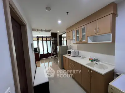Modern kitchen with sleek cabinetry and appliances in a bright, open layout
