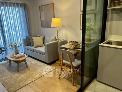 Cozy modern living room with stylish decor and compact dining area