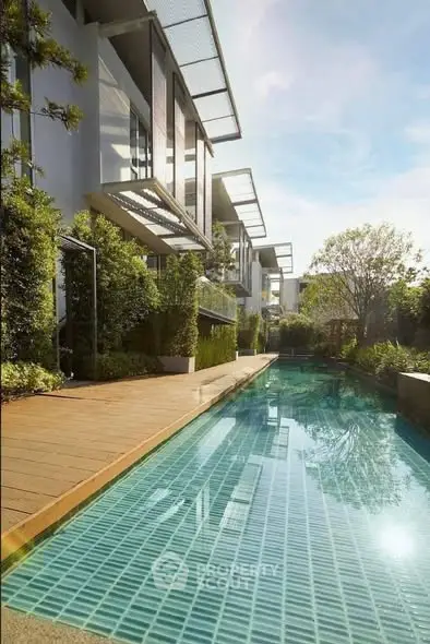 Luxurious modern townhouse with private pool and lush greenery, perfect for serene living.