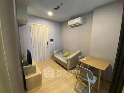 Cozy living room with modern air conditioning and compact furniture in a stylish apartment.