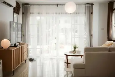 Bright and airy living room with modern decor and large windows