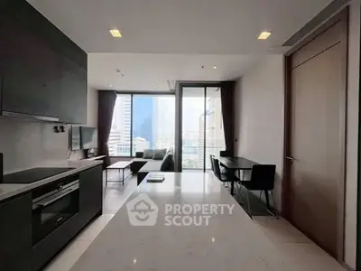 Modern open-layout kitchen and living room with city view