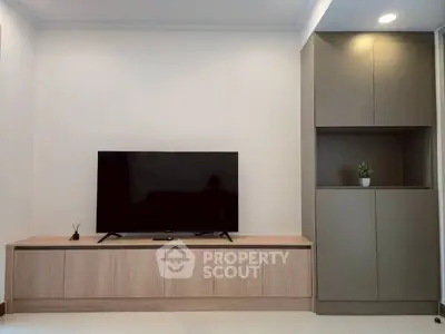 Modern living room with sleek TV unit and stylish cabinetry