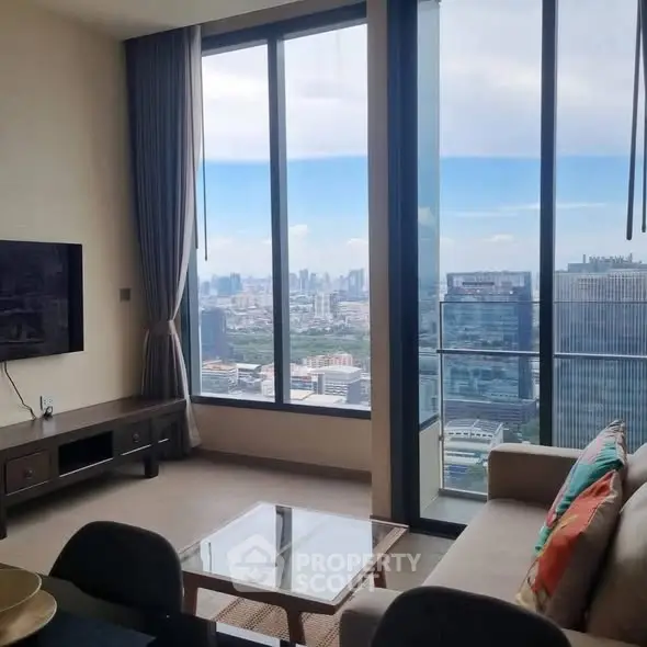 Luxurious living room with floor-to-ceiling windows offering stunning cityscape views.
