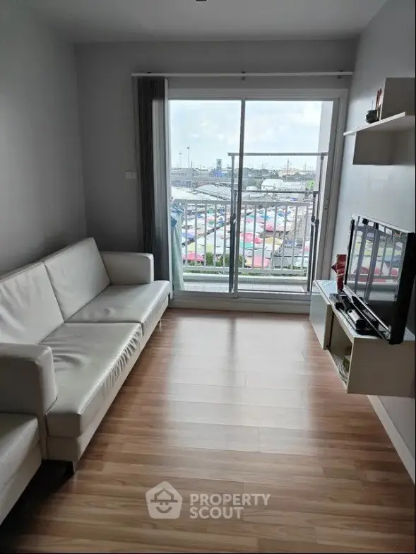 Modern living room with balcony view and sleek furniture