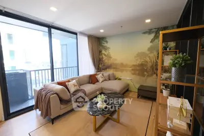 Spacious living room with modern decor and large balcony access