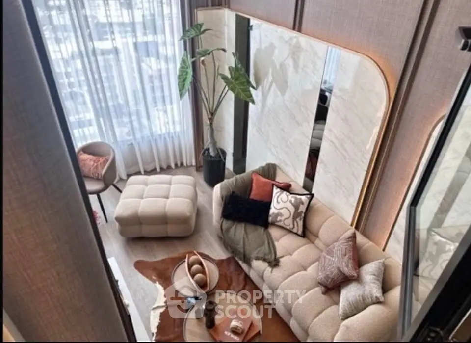 Luxurious modern living room with stylish furniture and large window view.