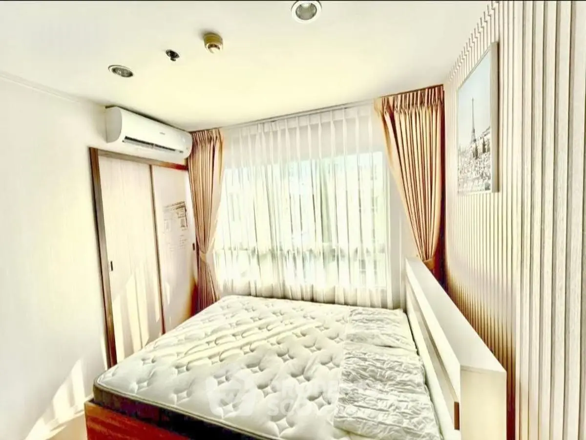 Bright and cozy bedroom with large window and elegant curtains