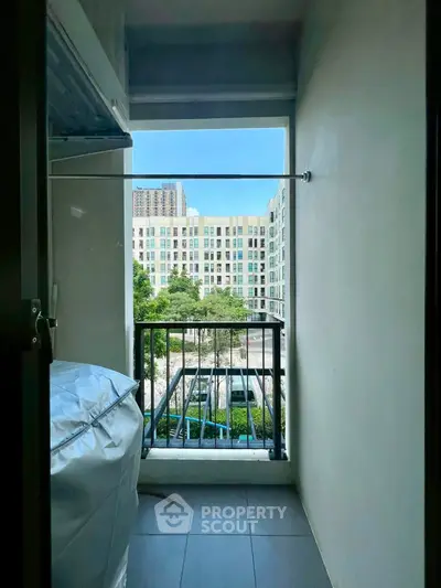 Charming balcony view with cityscape backdrop, perfect for urban living enthusiasts.