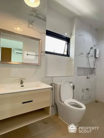 Modern bathroom with sleek fixtures and elegant marble walls