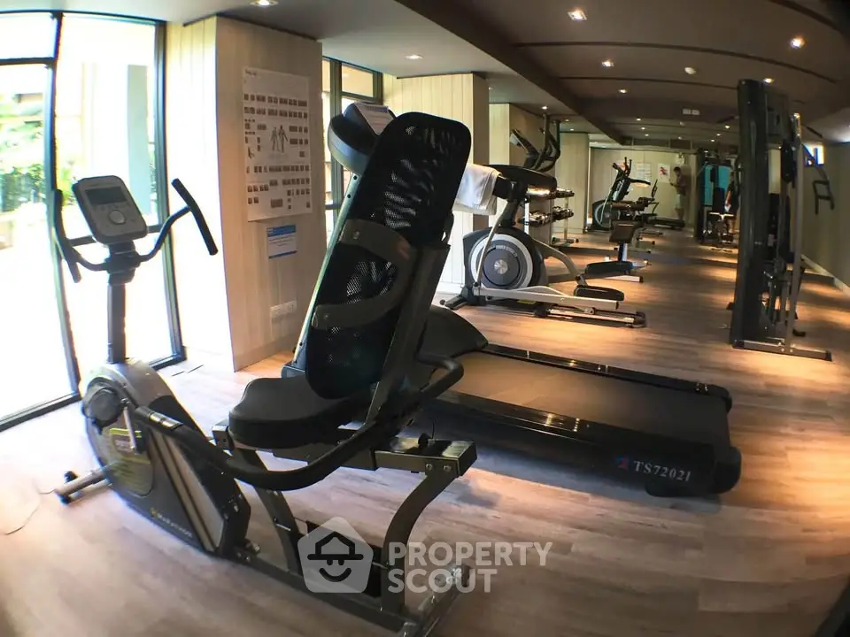 Modern gym with state-of-the-art fitness equipment in a residential building.