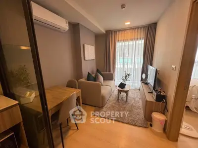 Modern living room with cozy seating and stylish decor, featuring a TV and dining area, perfect for relaxation.