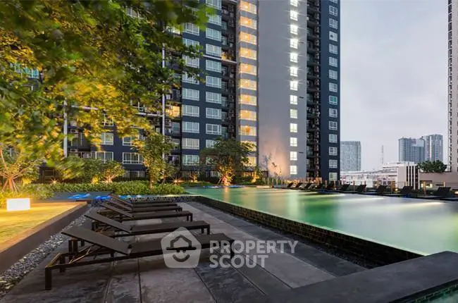 Luxurious high-rise apartment with stunning pool and city views, perfect for urban living.