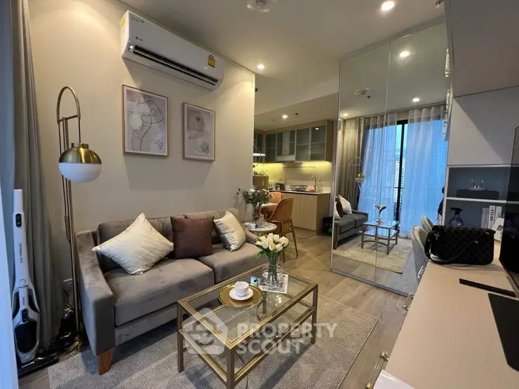 Chic modern living room with elegant decor and open kitchen layout, perfect for urban living.