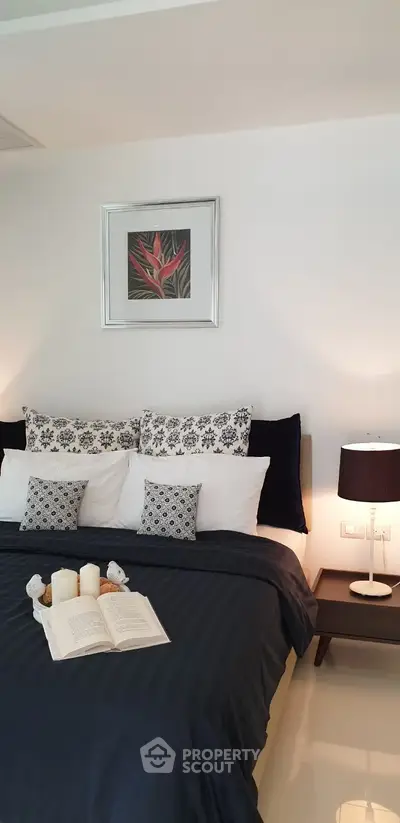 Elegant bedroom with stylish decor and cozy bedding, perfect for relaxation and comfort.