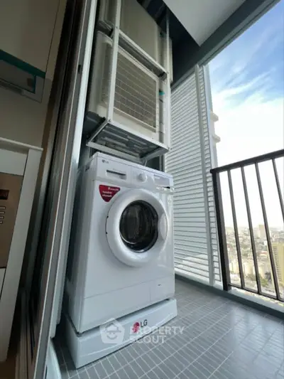Modern balcony with washing machine and city view, perfect for urban living.