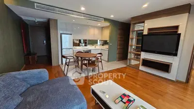 Spacious modern living room with open kitchen and stylish furniture