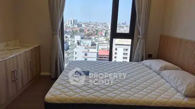 Spacious bedroom with city view and modern furnishings