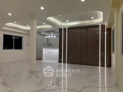 Luxurious modern living room with elegant lighting and marble flooring