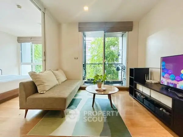 Modern living room with cozy sofa, stylish decor, and lush balcony view.