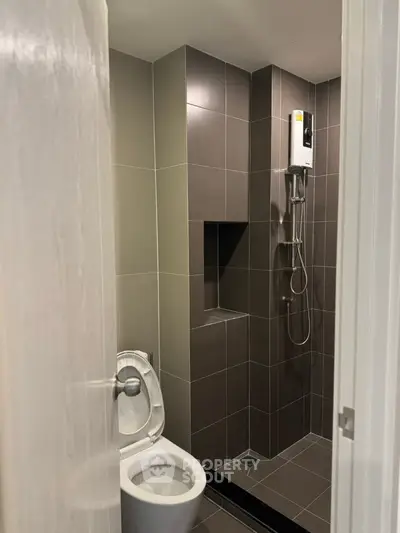 Modern bathroom with sleek tile design and shower area