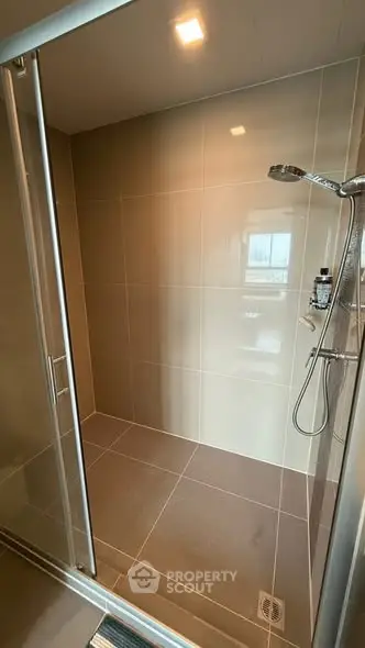 Modern bathroom with sleek shower enclosure and contemporary fixtures