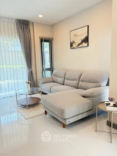 Modern living room with stylish gray sofa and elegant decor