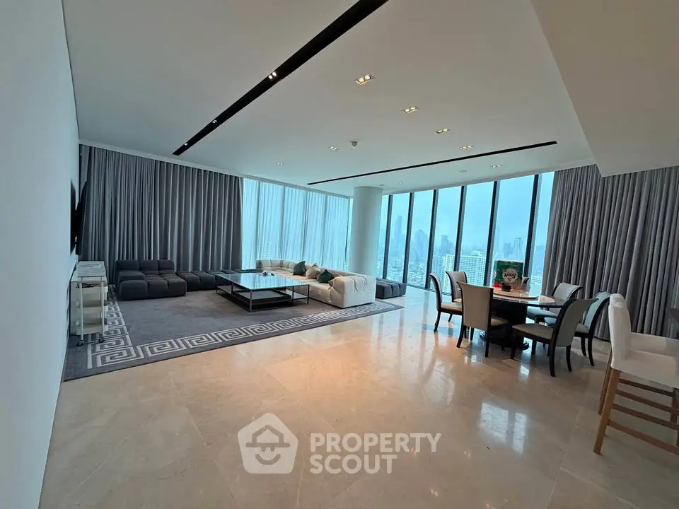 Luxurious modern living room with panoramic city views and elegant dining area.