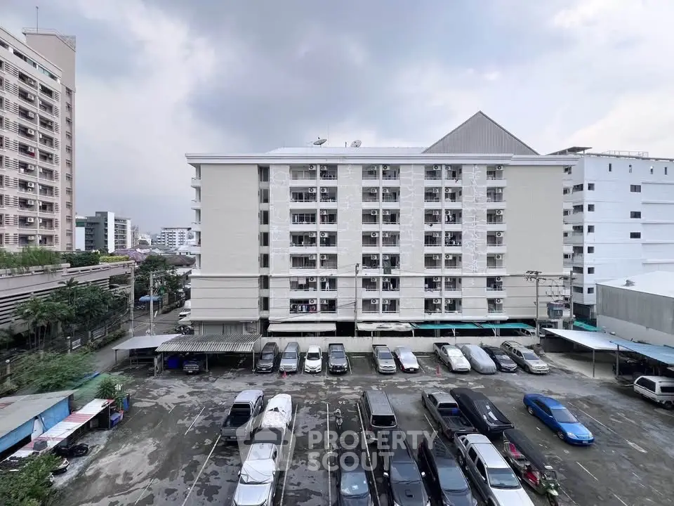 Spacious apartment building with ample parking in urban setting