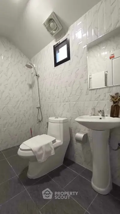 Modern bathroom with sleek fixtures and elegant tile design