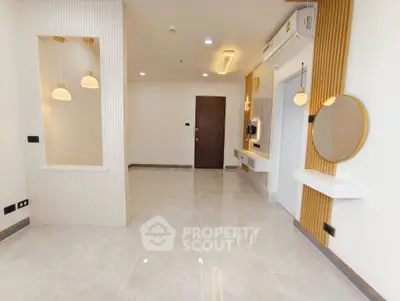 Modern minimalist living room with elegant lighting and sleek design