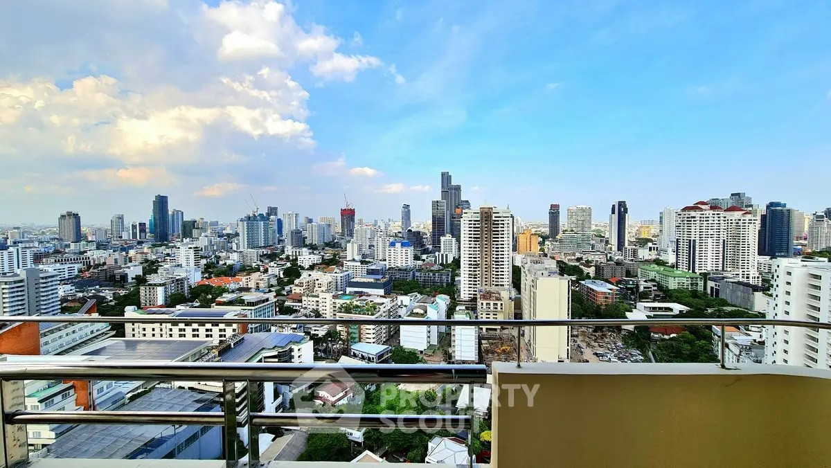 Stunning cityscape view from a high-rise balcony showcasing urban skyline and vibrant city life.