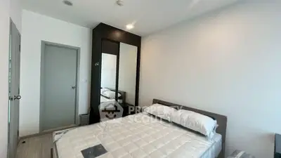 Modern bedroom with sleek design and ample natural light
