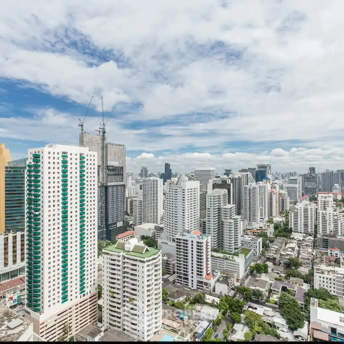 Stunning cityscape view of modern high-rise buildings under a clear blue sky.