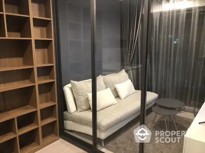 Modern living room with glass partition and cozy sofa