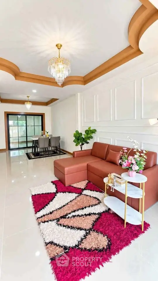 Luxurious living room with elegant chandelier and modern decor