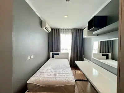 Modern minimalist bedroom with sleek design and ample natural light