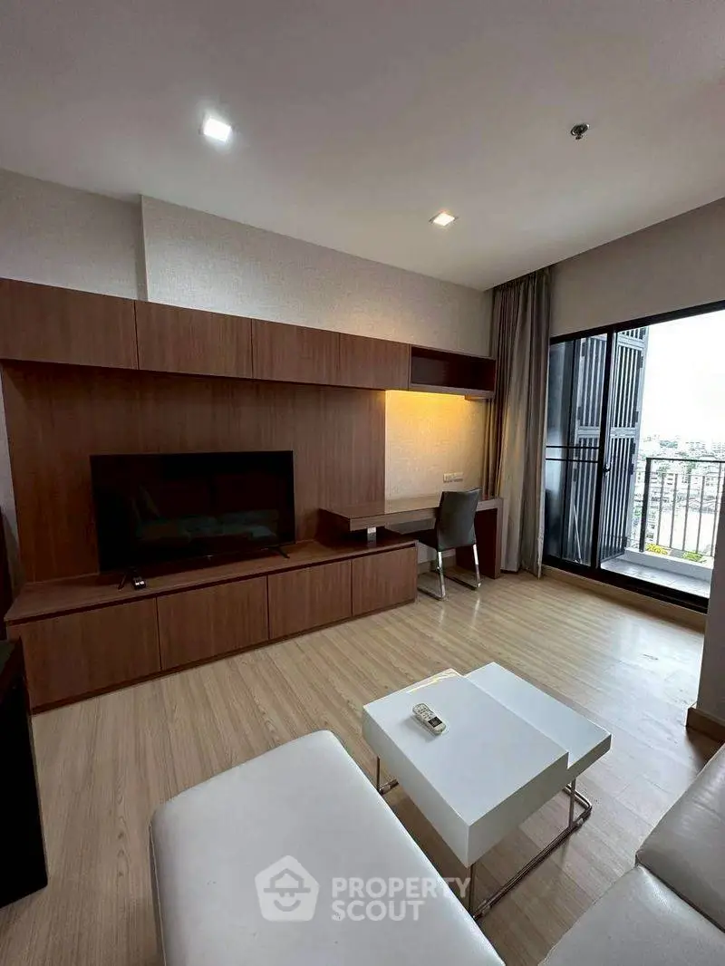 Modern living room with sleek wooden furniture and balcony view in a stylish apartment.