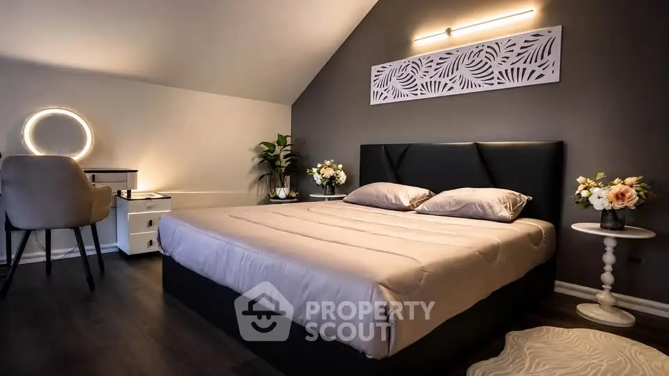 Luxurious bedroom with modern decor and elegant lighting, perfect for relaxation and comfort.