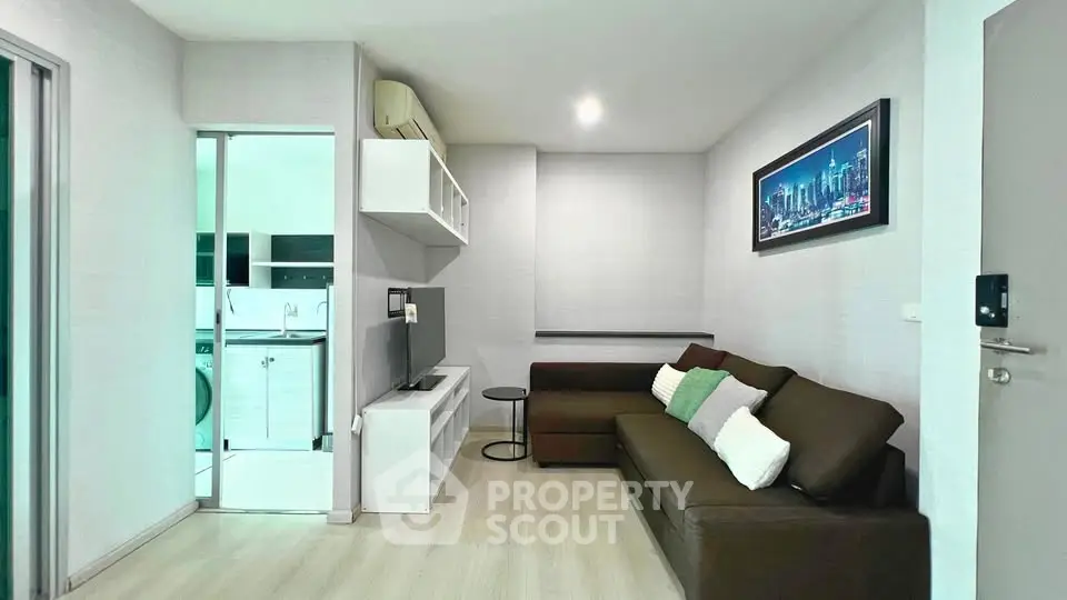 Modern living room with sleek furniture and stylish decor in a contemporary apartment.