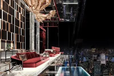 Luxurious modern living room with stunning city skyline view and elegant interior design.