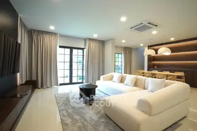 Spacious modern living room with elegant decor and ample natural light