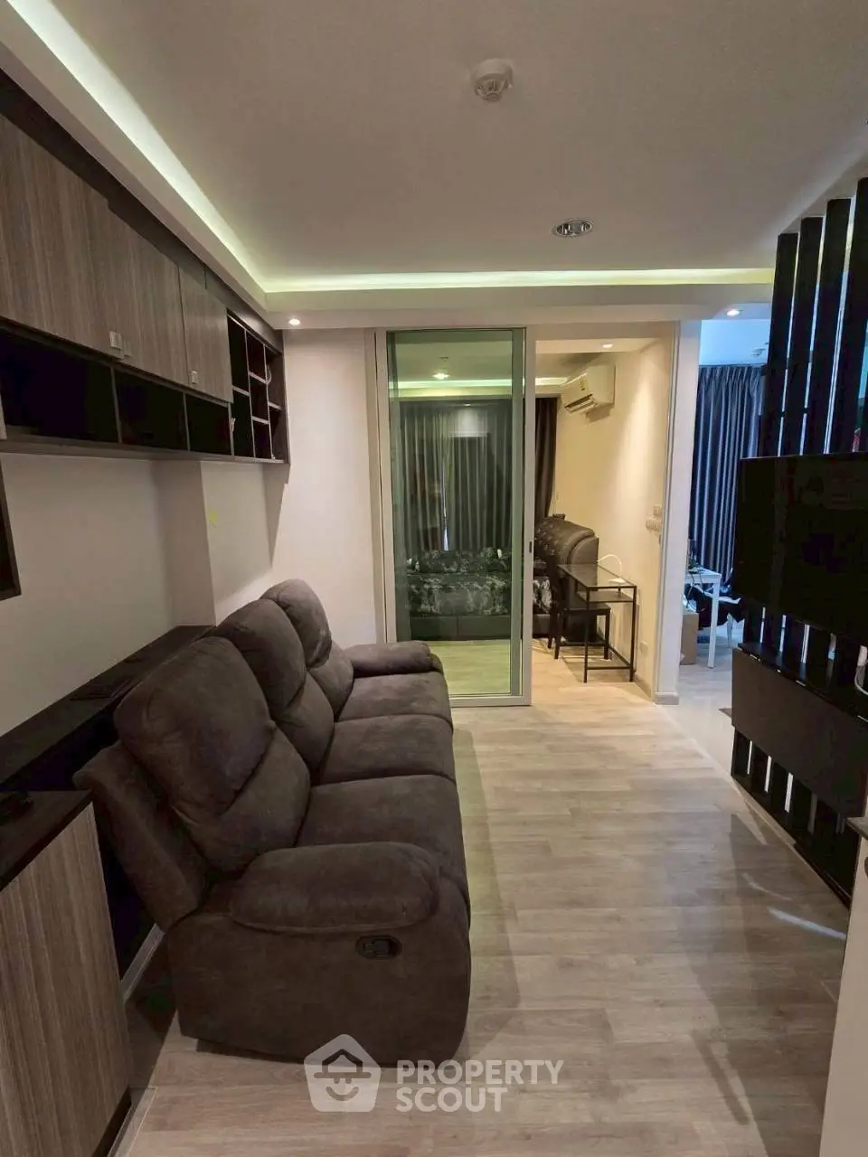 Modern living room with cozy sofa and stylish decor in a contemporary apartment.