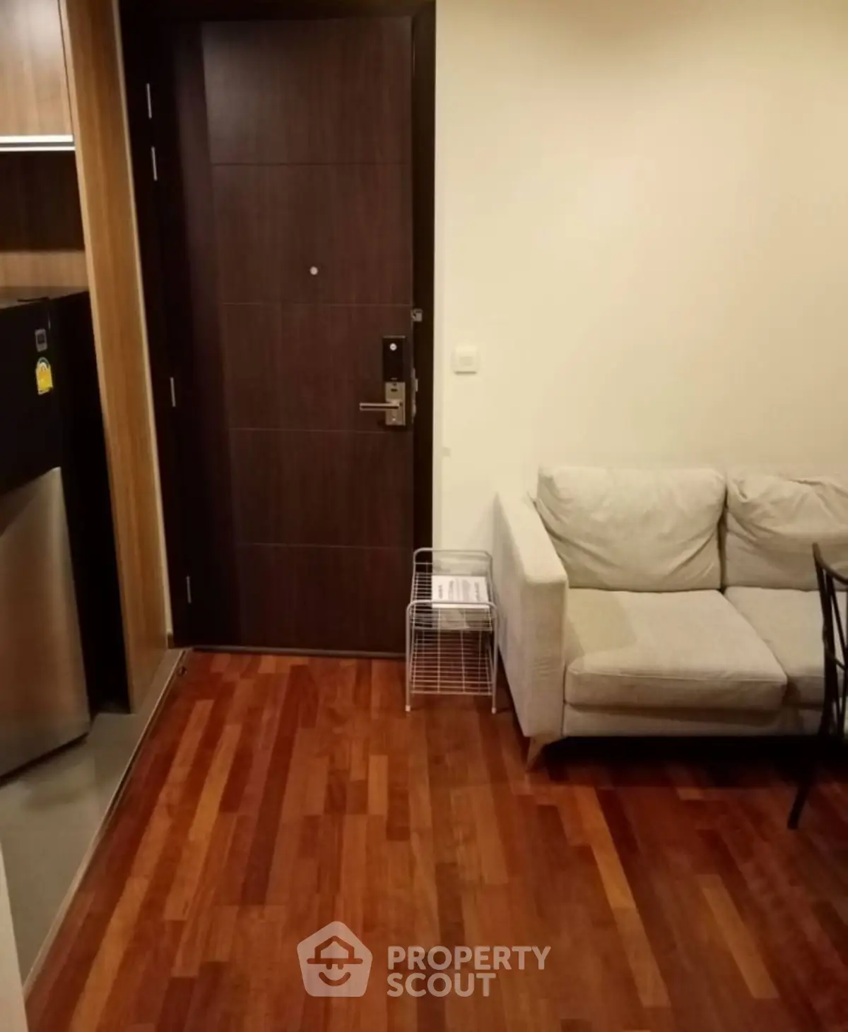 Cozy apartment entrance with wooden flooring and modern furniture