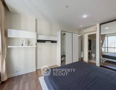 Spacious modern bedroom with sleek design and city view
