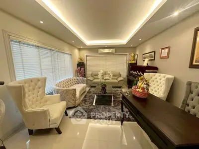 Elegant living room with plush seating and modern lighting, perfect for relaxation and entertaining.