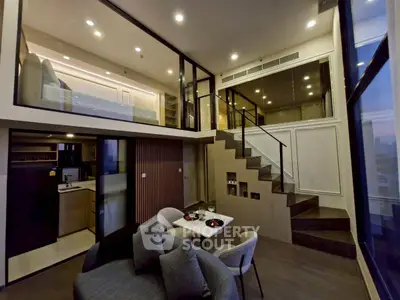 Luxurious modern loft with open layout, stylish kitchen, and cozy living area, perfect for urban living.