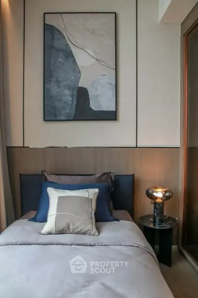 Modern bedroom with stylish decor and ambient lighting