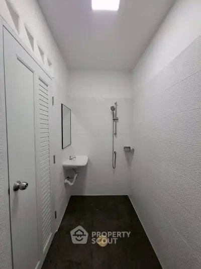 Minimalist bathroom with sleek shower and modern fixtures