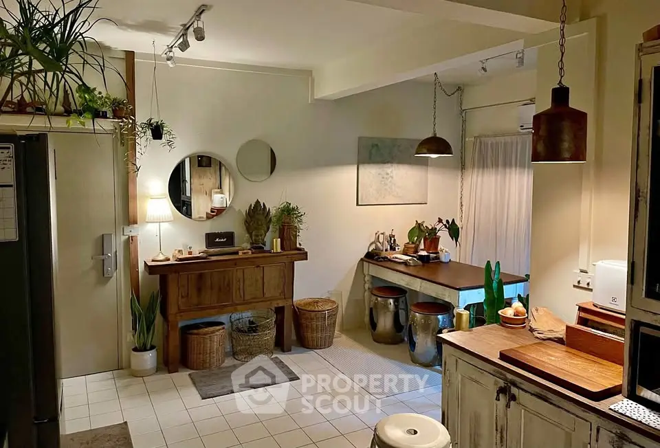 Charming rustic kitchen with warm lighting and vintage decor, perfect for cozy gatherings.
